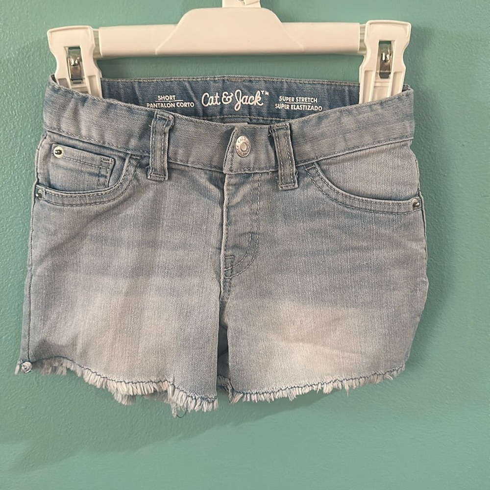 Here we have girl jeans, shorts, size 5T brand is cat jack.